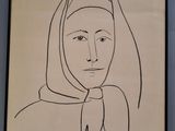 dessin représentant une femme portant un foulard sur la tête, dans un cadre noir