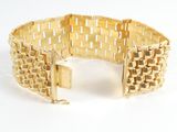 an image of a gold bracelet on a white background