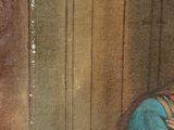 painting of a woman in a blue dress leaning against a wooden wall