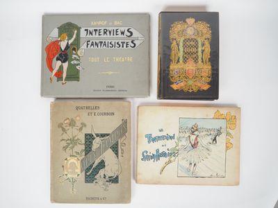 several books are lined up on a white surface