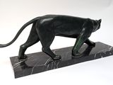 statue of a black panther on a marble base