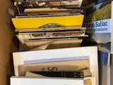 a box full of books that are sitting on top of a table