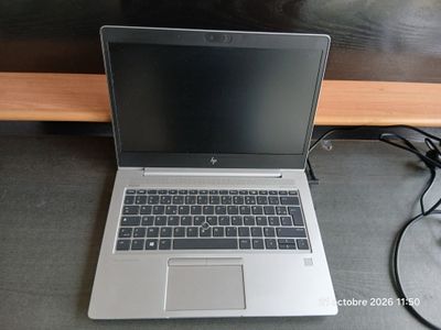 a laptop computer that is sitting on a table