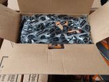a cardboard box with a bunch of screws inside of it