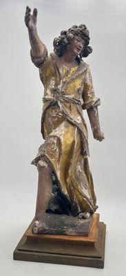 bronze statue of a woman holding a bird on a wooden base