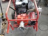 an image of a small engine on a cart in a garage