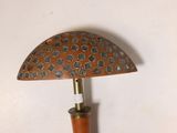 a small umbrella with a wooden handle on a table