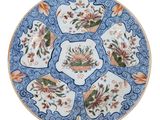 an image of a blue and white plate with flowers on it
