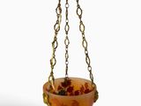 an image of a planter hanging from a chain on a white background