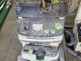 a machine that is sitting on the floor next to other machines