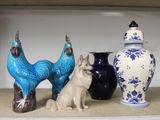 three vases on a shelf with a dog and a cat