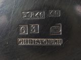 a close up of a silver plate with numbers on it