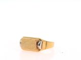 an image of a gold ring with a stone in the middle