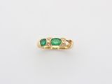 an emerald and diamond ring
