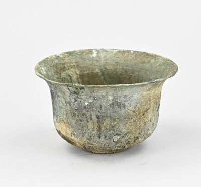 a small bowl that is sitting on a white surface