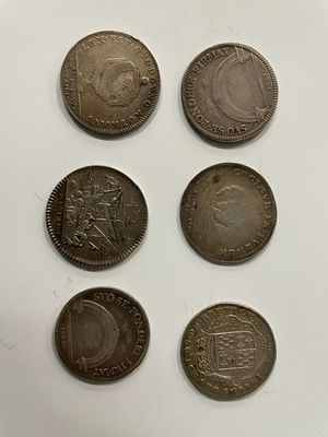 six different british coins are shown on a white surface