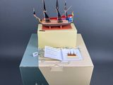 a small model of a ship on top of a box