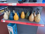 many different colored vases on the shelves in the store