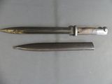 two knives are laying on a table next to each other