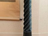 a vase that is sitting on a rug in a room