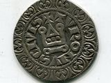 une vieille pièce d'argent sur laquelle figure le portrait d'un homme