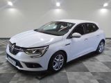 a white car is parked on a checkered floor in a garage