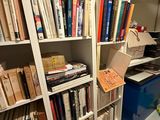 a room with a lot of books on the shelves
