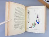 an open book with a drawing of a woman ' s shoes on it