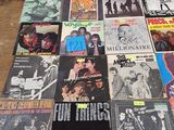 many different types of vinyl records on a table