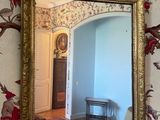 a mirror hanging on a wall in a room