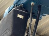 a blue crane hanging from the ceiling of a building