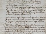 a close up of an old manuscript with writing on it