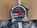 a measuring tape that is on top of a cardboard box