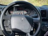 dashboard view of a car with a steering wheel and dashboard controls