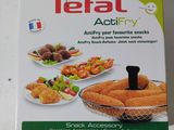 une boîte de snacks Tefal Actify posée sur une table