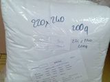 a pillow that has been wrapped in plastic on a table