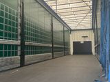 an image of a large warehouse with a lot of glass walls