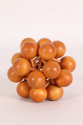 a bunch of small wooden balls on a white surface