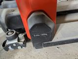 a close up of a machine that is working on a piece of metal