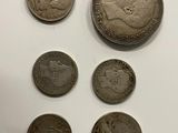 a close up of a bunch of coins sitting on top of a table