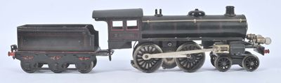 un petit train posé sur une surface blanche