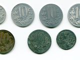 six types de pièces différents sont présentés sur une surface blanche