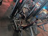 a gym with a lot of machines in it