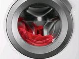 the front view of a washing machine with a red cloth inside of it