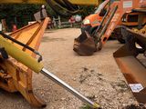 a large yellow machine that is sitting in the dirt