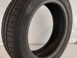 a close up of a tire on a white surface