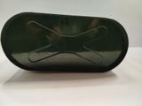 a green case that has a pair of scissors in it