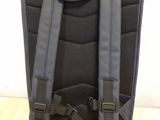 the back of a backpack with straps on it sitting on a wooden floor