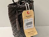a brown basket with a tag attached to it