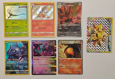 beaucoup de cartes pokemon différentes sur la table